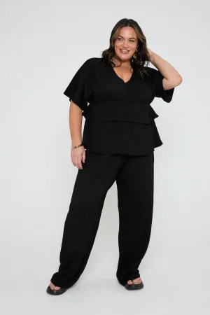 Loose fit textured trousers in black