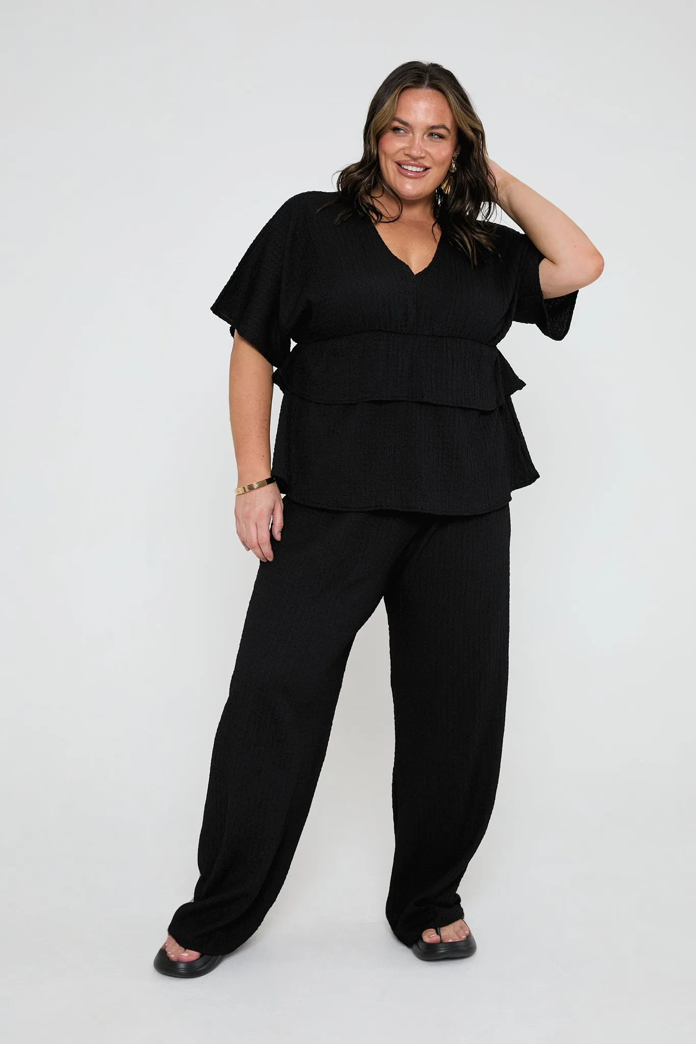 Loose fit textured trousers in black