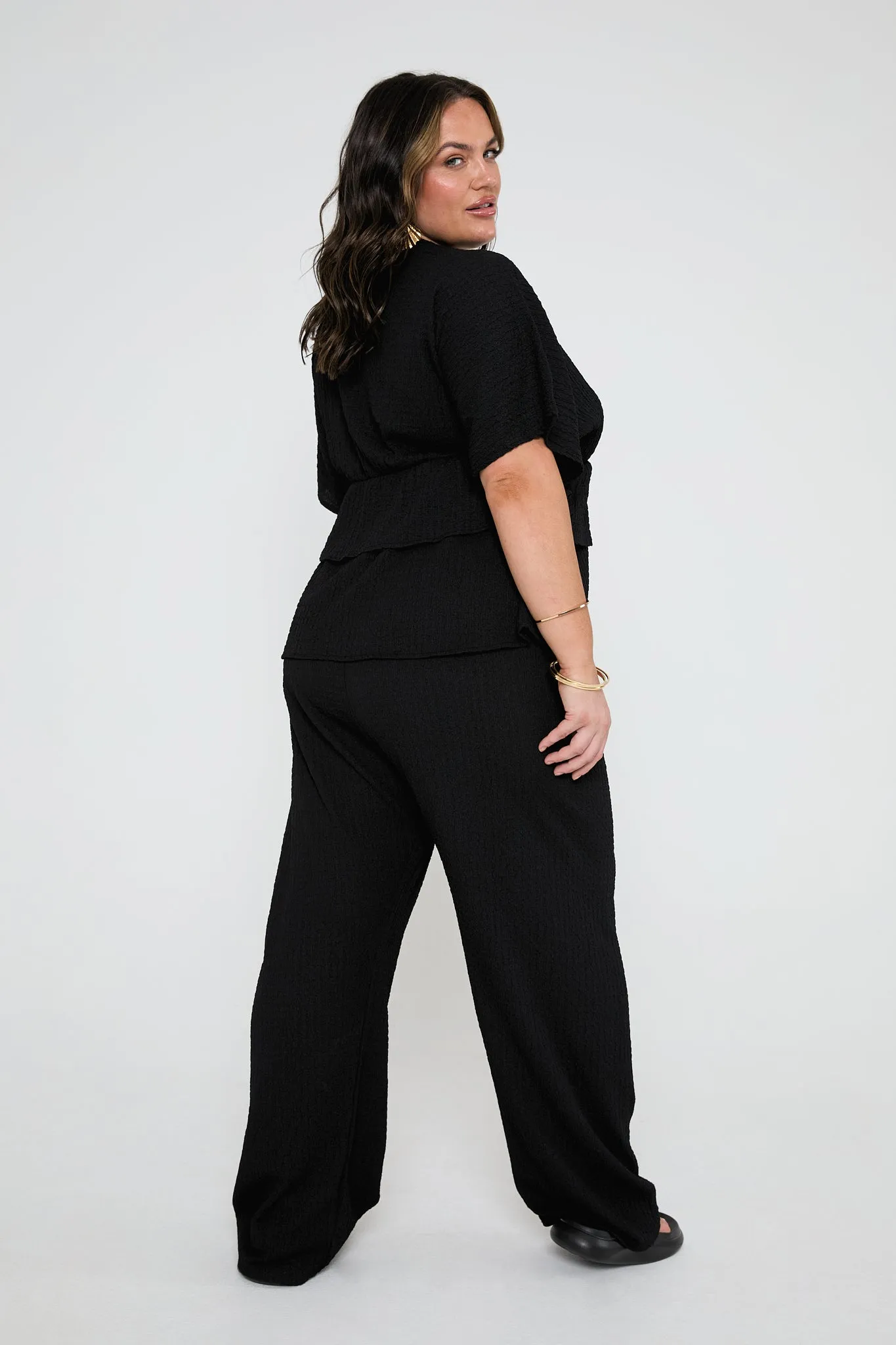 Loose fit textured trousers in black
