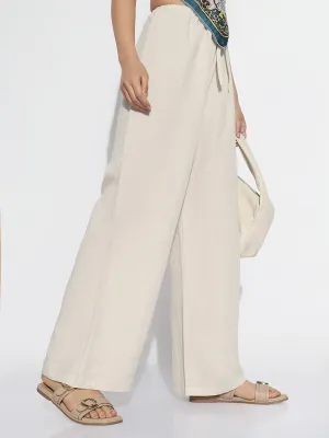 Women Beige Solid Loose Fit Trousers